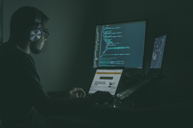 Programmer sitting in front of a computer