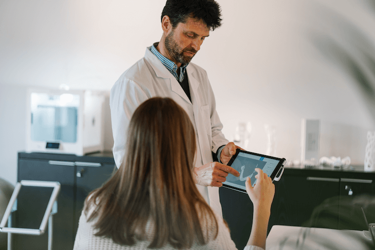 A doctor works with a patient